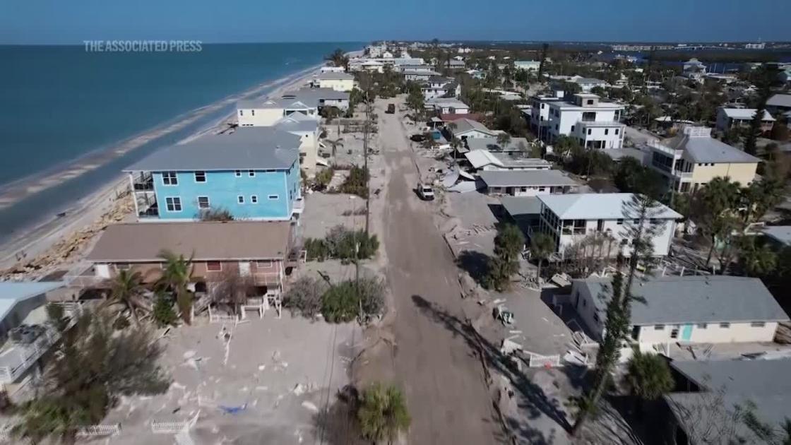 Florida digs out of mountains of sand swept in by backtoback hurricanes