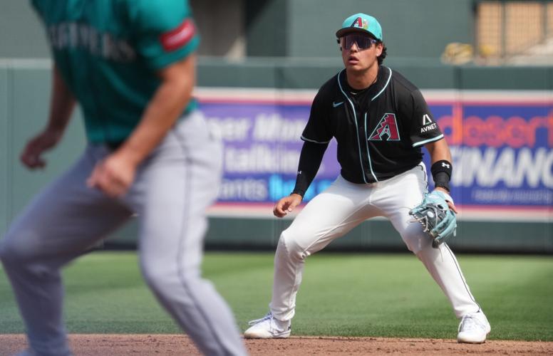 Arizona Diamondbacks infielder Demetrio Crisantes (5) tracks a pop-up against the Seattle Mariners at Salt River Fields on March 9, 2026.