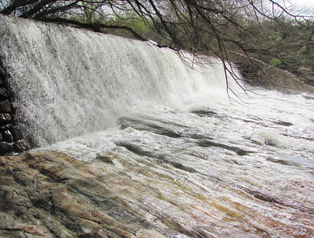 Water pouring from water mill chute] - The Portal to Texas History