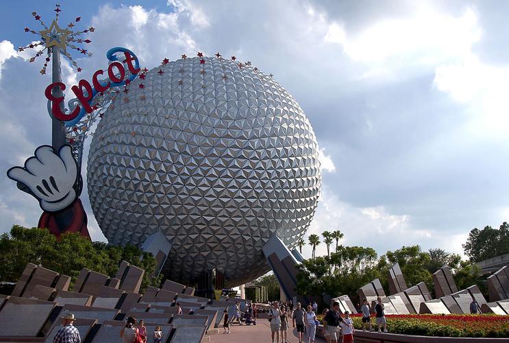 ORLANDO, FL - OCTOBER 8:  Guests leave Walt Disney World's Epcot October 8, 2003 near Orlando, Florida.  (Photo by Matt Stroshane/Getty Images)