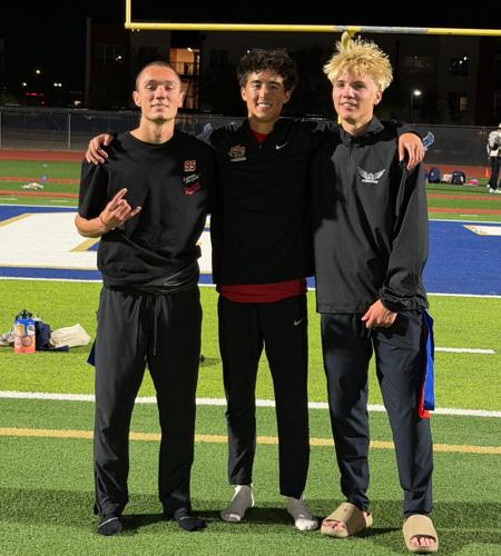 Mountain Ridge's Eric Reed (left) and Gage Mahn (right) with Boulder Creek's Greyson Han (middle) at the AIA State Track and Field Championships in Mesa at Mesa Community College on May 15, 2026.
