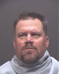 UA track coach arrested on domestic violence charges