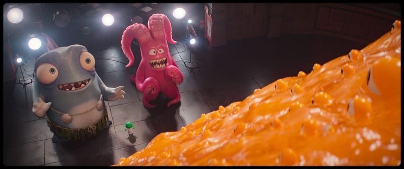Phillips, left, and Howard greet the mammoth, oozy Irene in "Minions & Monsters."