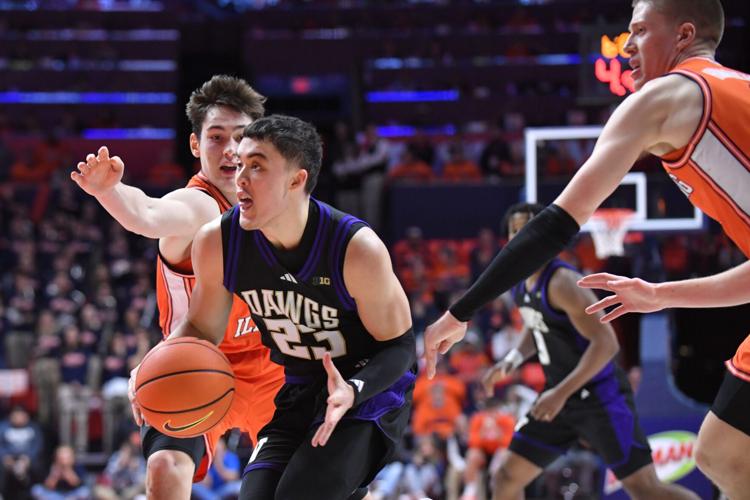 Jan 29, 2026; Champaign, Illinois, USA; Illinois Fighting Illini forward David Mirkovic (0) and Ben Humrichhous (3) pursue Washington Huskies guard JJ Mandaquit (23) with the ball during the second half at State Farm Center. Mandatory Credit: Ron Johnson-I