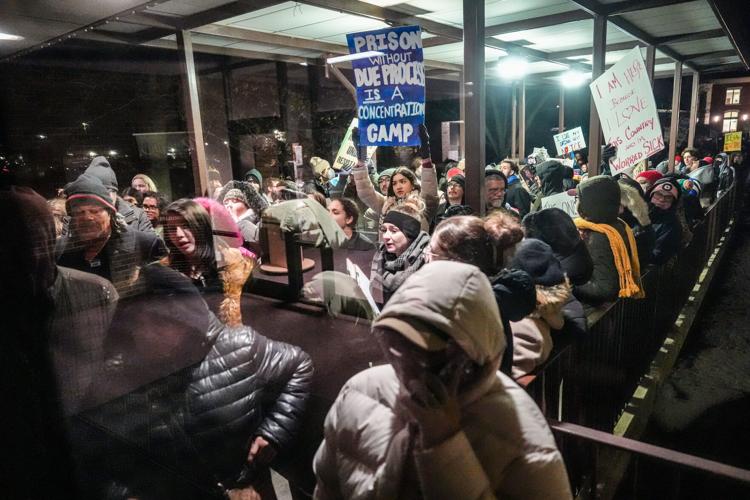 A large group of people are locked out of the city council meeting after protesting the proposed ICE warehouse detention center outside of Romulus City Hall, Monday, Feb. 23, 2026.