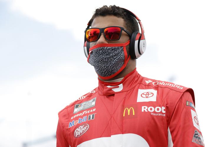 Bubba Wallace, the driver of the DoorDash Toyota, waits on the grid prior to the NASCAR Cup Series 63rd Annual Daytona 500 at Daytona International Speedway on February 14, 2021, in Daytona Beach, Florida.