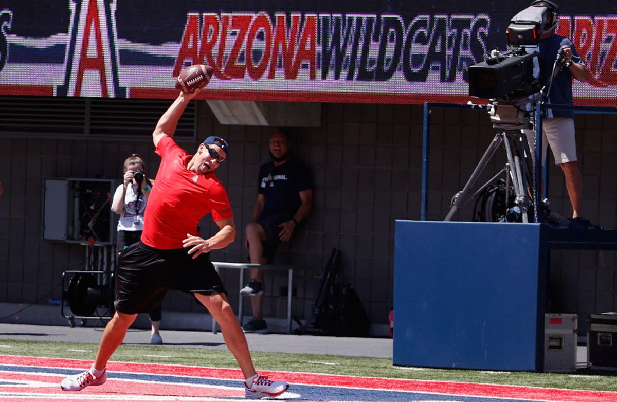 NFL athlete and University of Arizona Alum, Rob Gronkowski spikes the football in the end-zone while coaching Team Red to victory in the Arizona Spring game at Arizona Stadium on April 24, 2021 in Tucson, Arizona.