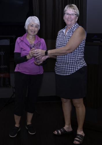 Andrea-Gray-receives-2026-President-Cup-trophy-from-Lori-Stegink.jpg