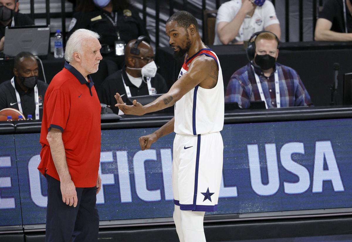 Head coach Gregg Popovich of the United States talks with Kevin Durant during an exhibition game against Nigeria at Michelob ULTRA Arena ahead of the Tokyo Olympics on Saturday, July 10, 2021 in Las Vegas, Nevada.