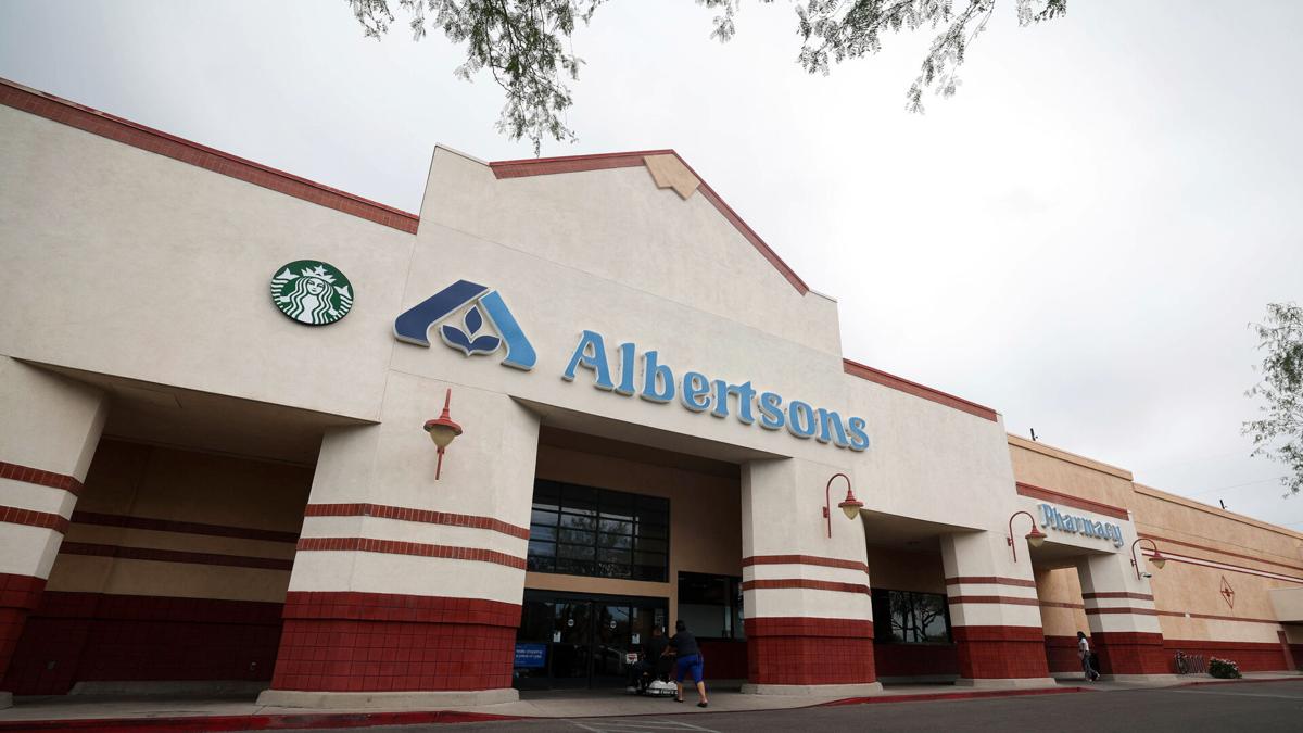 Albertsons shelves merger, sues Kroger