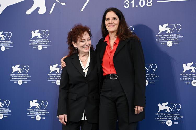 Nan Goldin, left, and director Laura Poitras attend the photocall for "All the Beauty and the Bloodshed" at the 79th Venice International Film Festival on Sept. 3, 2022, in Venice, Italy.