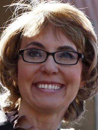 Giffords, back at tragic site, asks for wider gun checks    