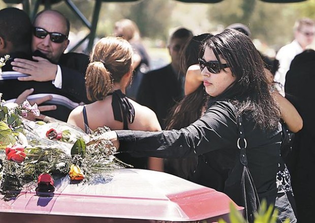 Woman who died in flash flood is OK in heaven, mourners told  