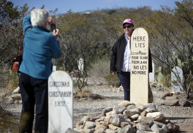 Wood 'headstones' replace inauthentic metal markers    
