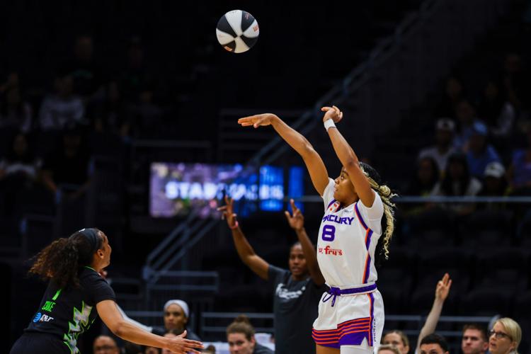 Phoenix Mercury guard Monique Akoa Makani (8) shoots a three-pointer against the Seattle Storm during the second quarter at Climate Pledge Arena in Seattle, on June 3, 2026.