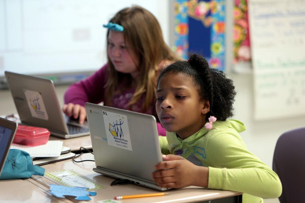 MAP test goes electronic- hands- Lydia and JaNyah