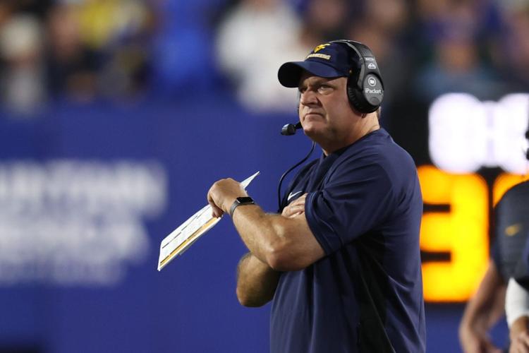 West Virginia Mountaineers head coach Rich Rodriguez looks on during the first quarter of the game against the Brigham Young Cougars at LaVell Edwards Stadium.