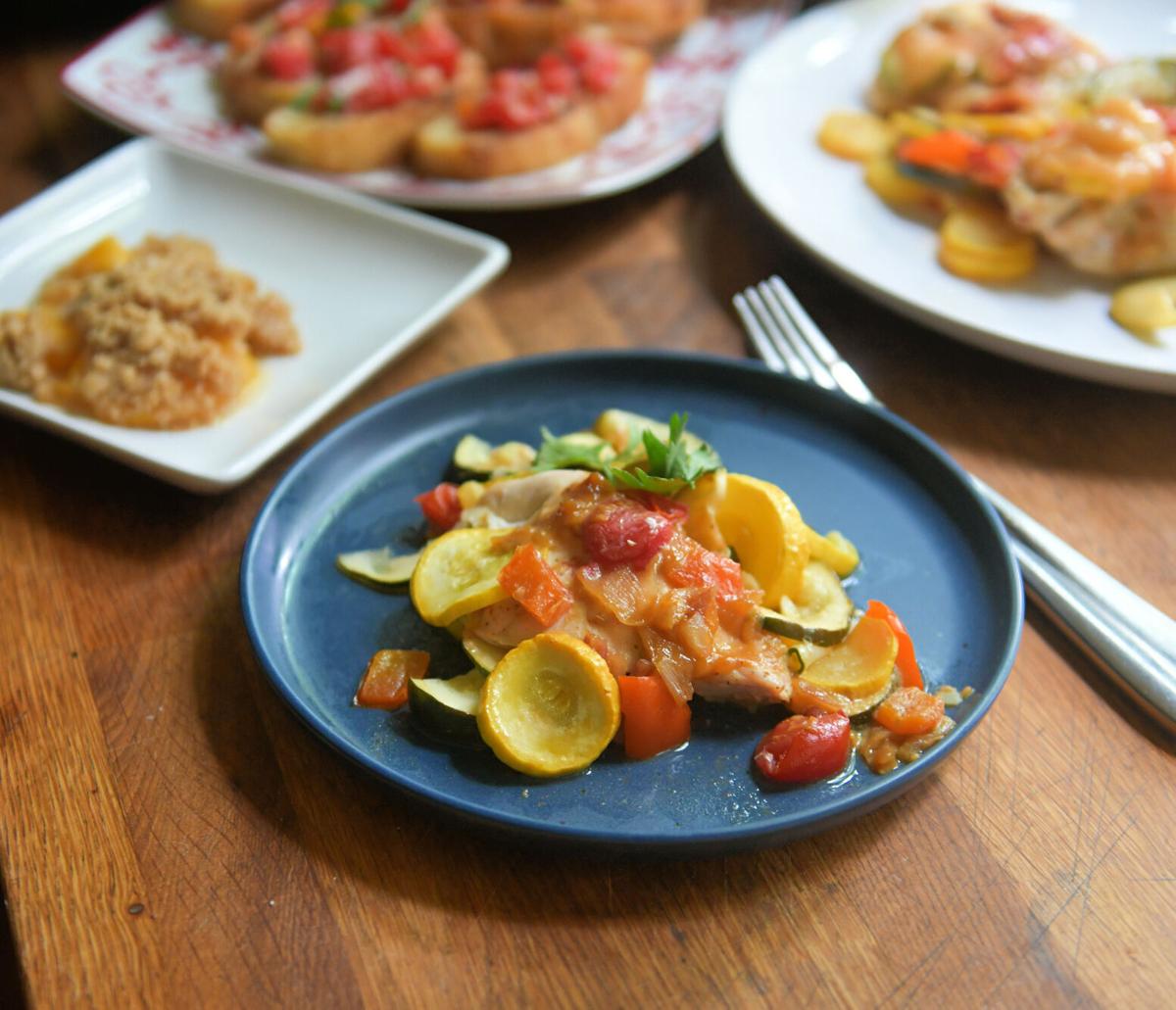 This easy budget entree features chicken grilled with summer vegetable in a foil packet.