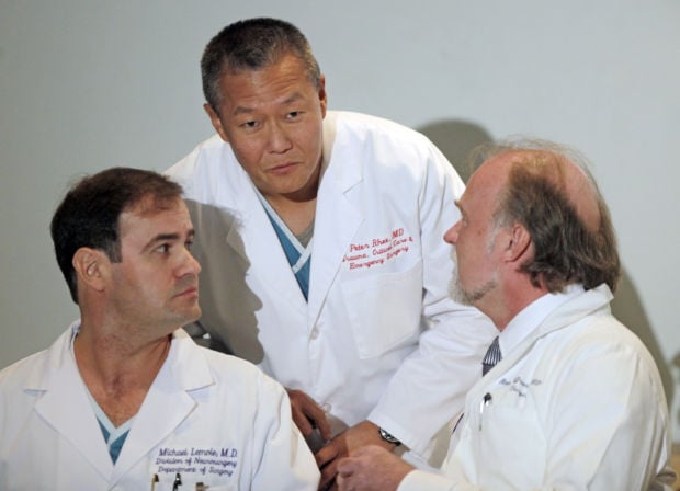 Dr. Peter Rhee, Dr. Michael Lemole, Dr. Rainer Gruessner