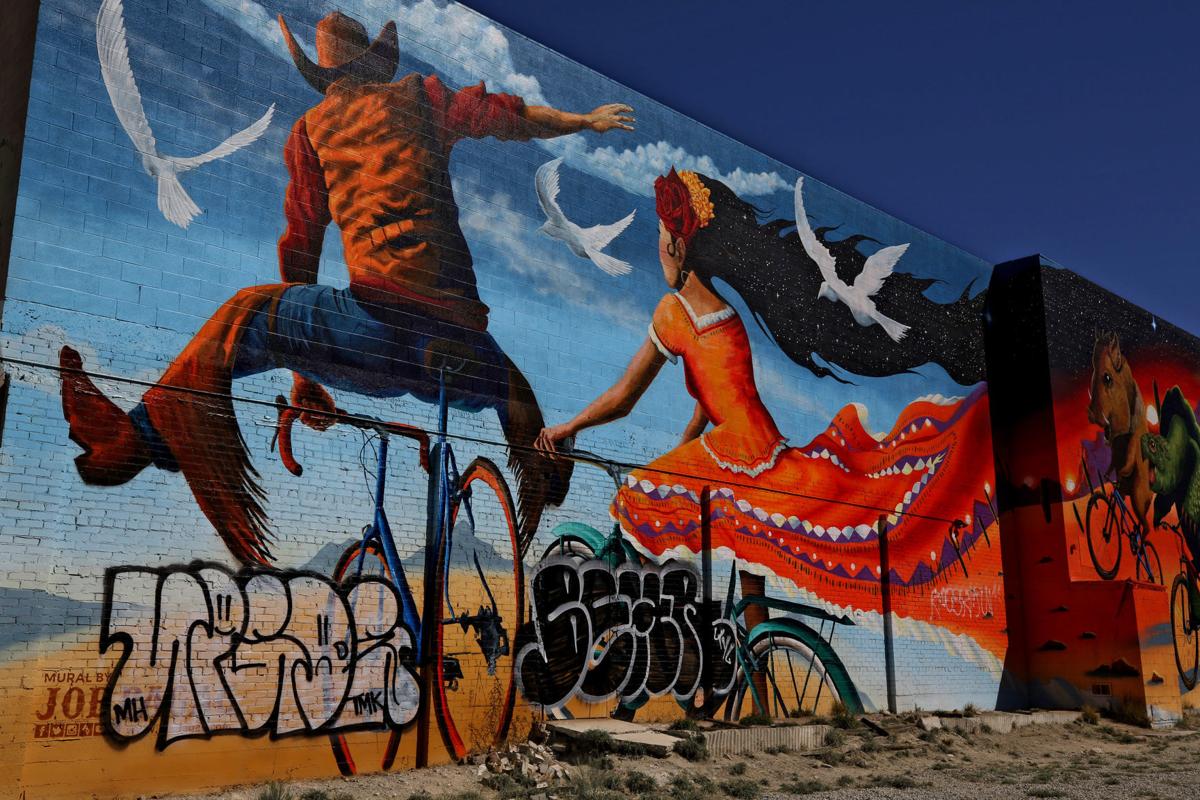 Colorful painting by muralist Pagac tagged near downtown