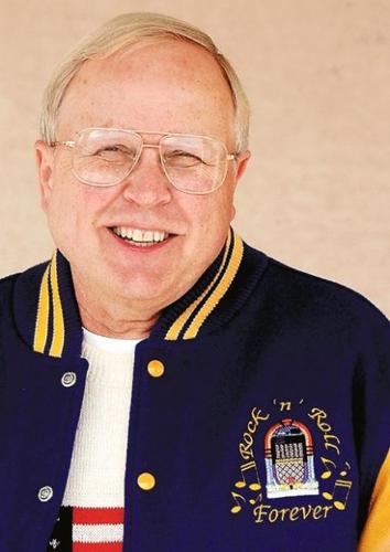 Music fan keeps signatures of rock stars on everything from posters to prized guitars  