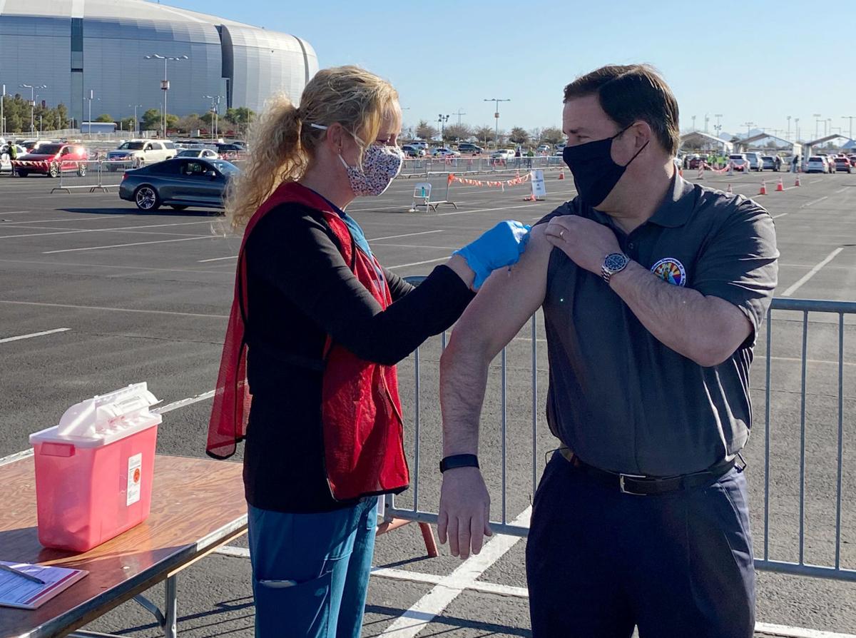 Ducey encourages vaccination, sorry for registration woes