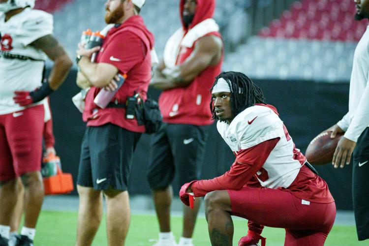 Elijah Jones (28) looks up to the replay during Cardinals training camp at State Farm Stadium on July 29, 2026, in Glendale.
