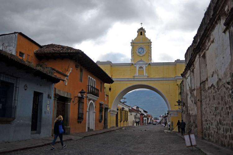 People walk in the streets of Antigua ahead of the XXVI Ibero-American Summit in Antigua on November 14, 2018. (JOHAN ORDONEZ/AFP/Getty Images/TNS) *FOR USE WITH THIS STORY ONLY*