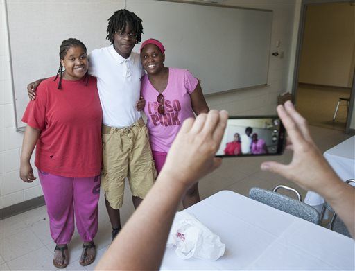 Adopted teen reunites with half-sisters at Jackson school