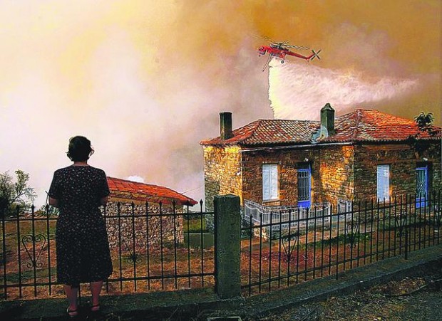 New, old fires rage in Greece  