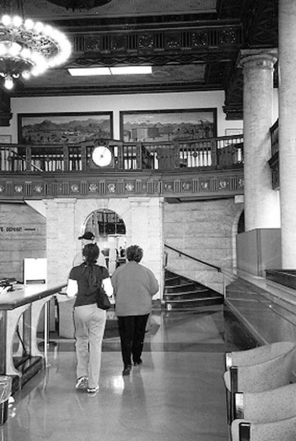 Bank building's new owner strips historic murals  