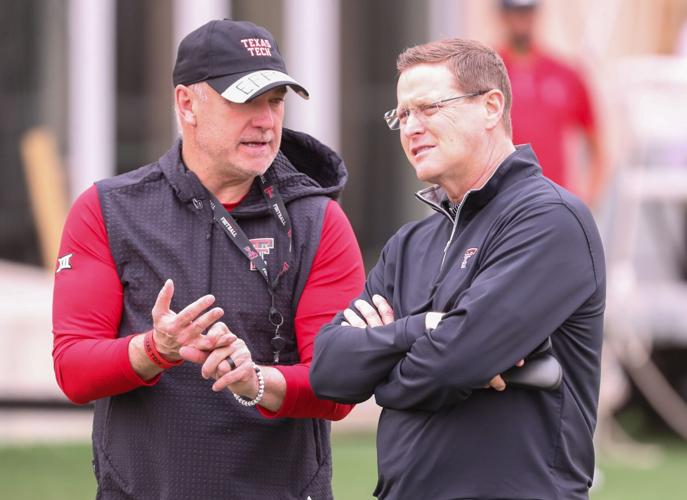 Texas Tech director of athletics Kirby Hocutt (right) speaks with Joey McGuire during spring practice, Tuesday, April 1, 2025, at the Womble Football Center.