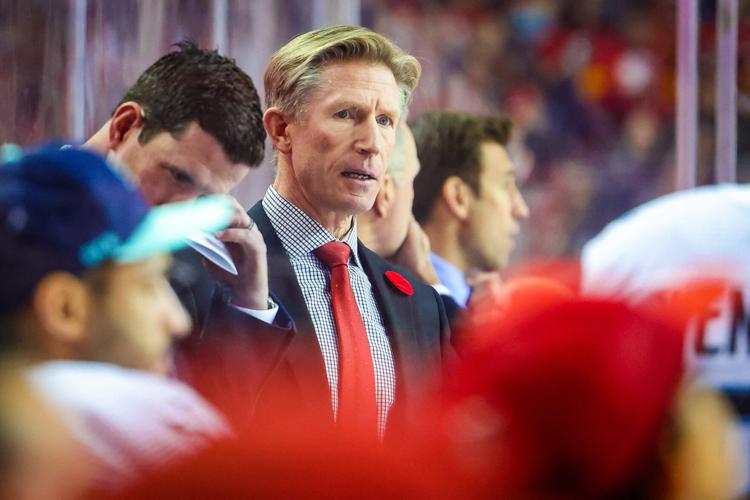 Seattle Kraken head coach Dave Hakstol on his bench against the Calgary Flames during the second period at Scotiabank Saddledome in Calgary, Alberta, on Nov. 1, 2022.