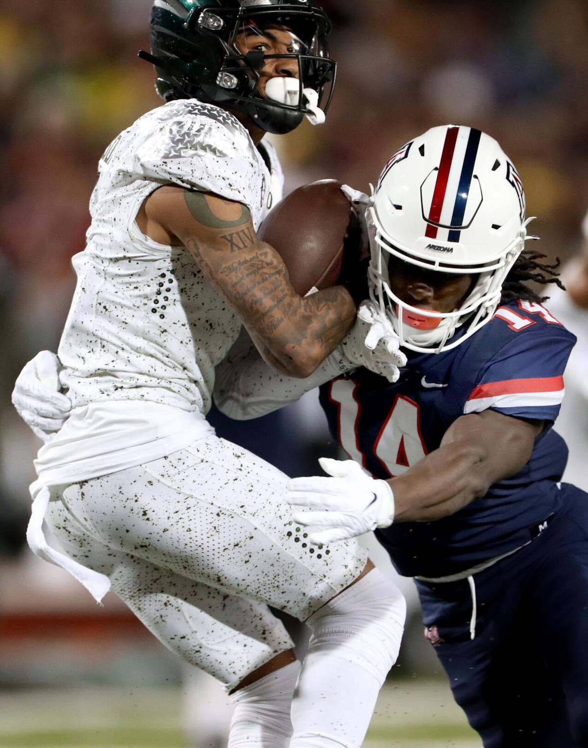 S Christian Young & OT Jordan Morgan talk after Arizona's 49-22 loss to  Oregon