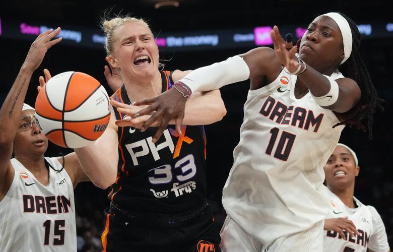 Phoenix Mercury guard Sami Whitcomb (33) fights for a loose ball with Atlanta Dream guard Rhyne Howard (10) at Mortgage Matchup Arena in Phoenix on Aug. 22, 2026.