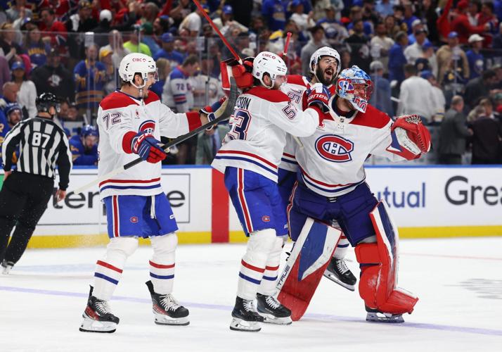 May 18, 2026; Buffalo, New York, USA; The Montréal Canadiens celebrate an overtime win over the Buffalo Sabres in game seven of the second round of the 2026 Stanley Cup Playoffs at KeyBank Center. Mandatory Credit: Timothy T. Ludwig-Imagn Images