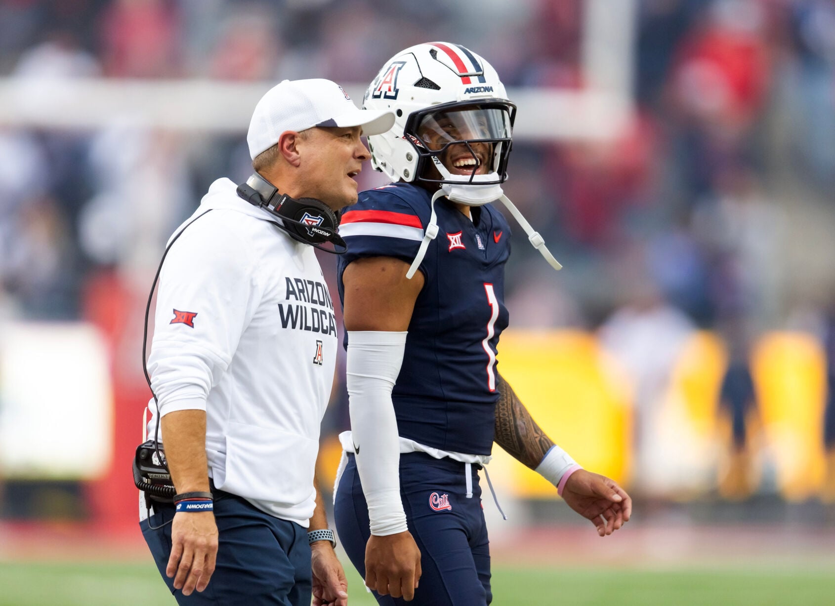 Arizona Wildcats defensive coordinator Danny Gonzales with quarterback Noah Fifita (1) against the Baylor Bears at Casino Del Sol Stadium in Tucson on Nov. 22, 2025.