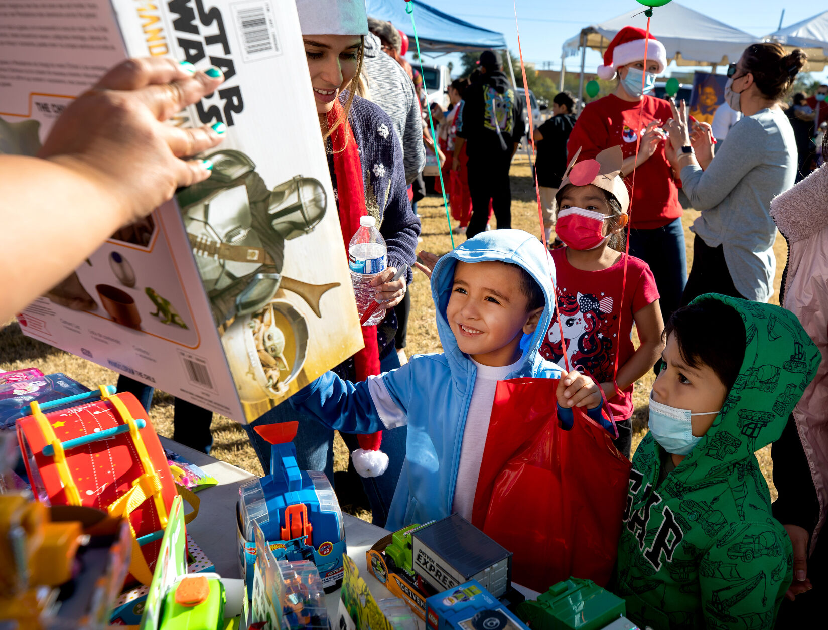 Photos: Kids Receive Toys, Take Pictures With Santa For NOVA's Miracle ...