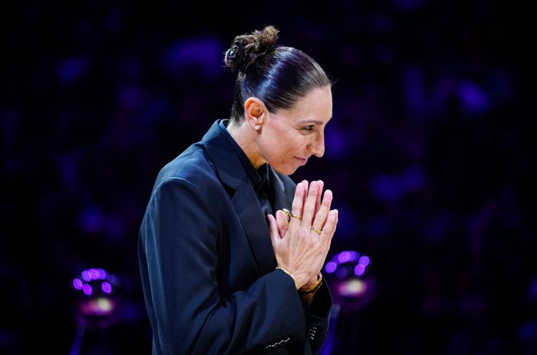Former Mercury guard Diana Taurasi bows her head in appreciation during her Ring of Honor ceremony at halftime of a game at Mortgage Matchup Center in Phoenix, Ariz. on August 16, 2026.