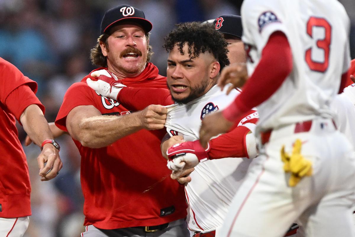 Willson Contreras of the Boston Red Sox is held back after an altercation against the Washington Nationals during the fourth inning at Fenway Park on June 30, 2026, in Boston.