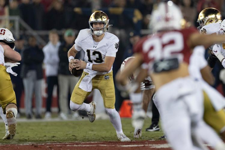 Nov 29, 2025; Stanford, California, USA; Notre Dame Fighting Irish quarterback CJ Carr (13) runs with the football during the first quarter against the Stanford Cardinal at Stanford Stadium. Mandatory Credit: Stan Szeto-Imagn Images