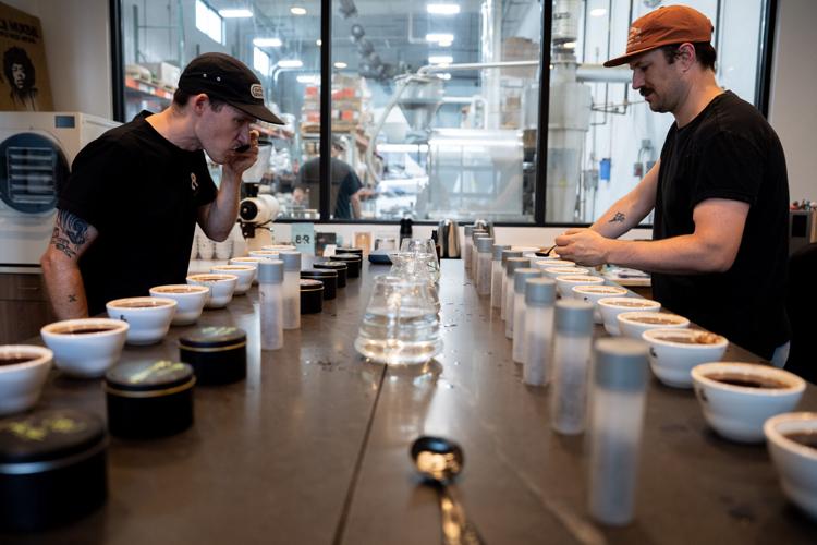 Max Oden, and Ty Telgenhof evaluate and taste the different coffee roasts to make sure they’re up to standard inside 8th and Roast Coffee’s training lab and roasting facility, in Nashville, Tenn., on Tuesday, May 19, 2026.