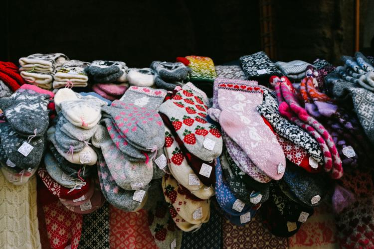 Layers of colourful & patterned woolen socks on the market stall