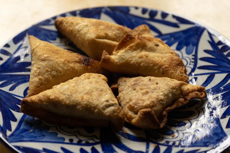 Somali Sambusa, stuffed triangular pastries made from a recipe included in "Kitchens of Hope" by Minnesota authors Linda S. Svitak, Christin Jaye Eaton and Lee Svitak Dean.