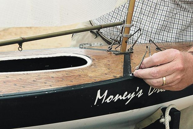 Sailboats race across a pond  