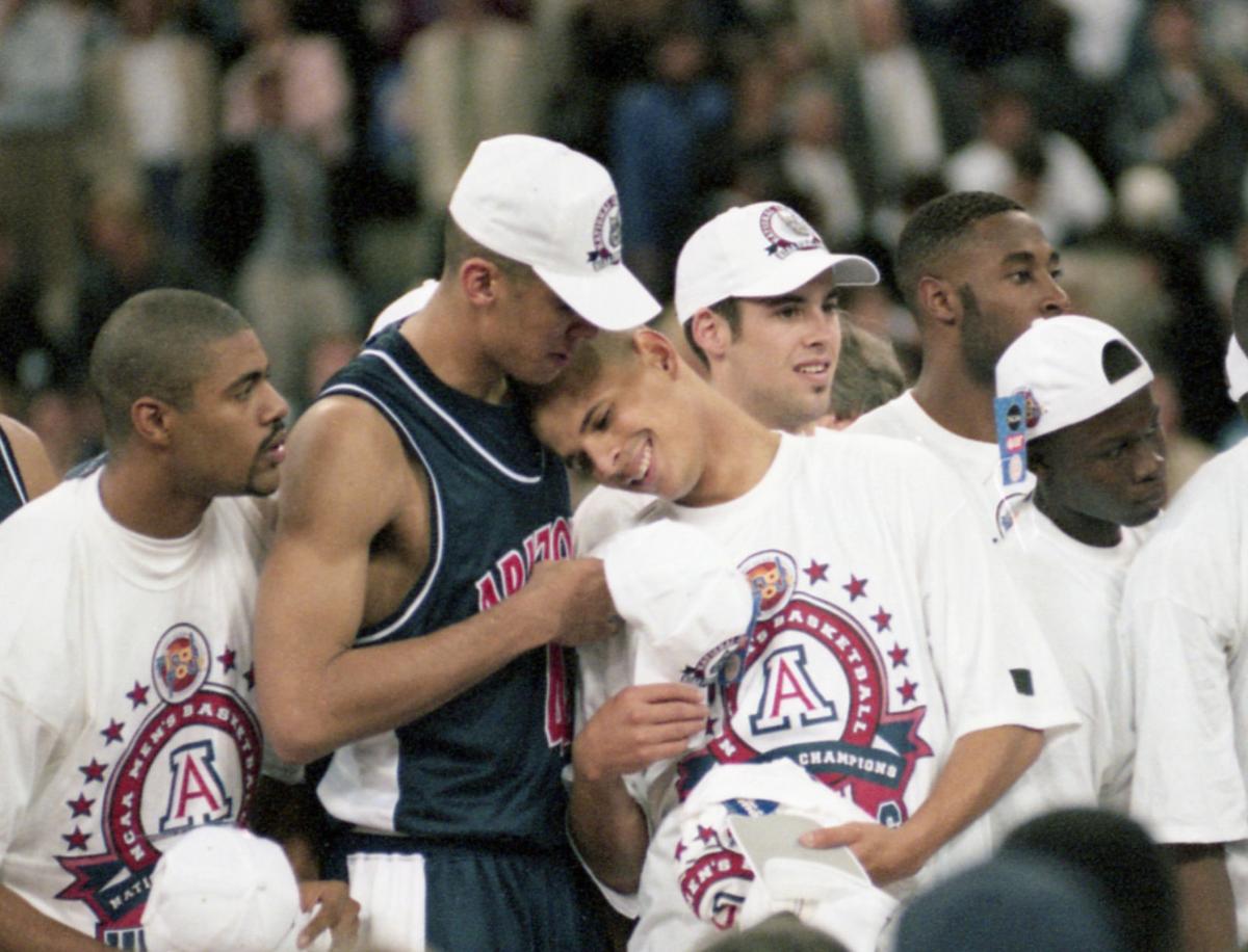 Stars of Arizona’s 1997 title team celebrate during replay of national