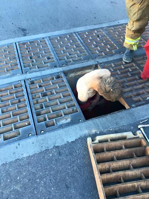 Firefighters Rescue Naked Man from Storm Drain in Downtown 