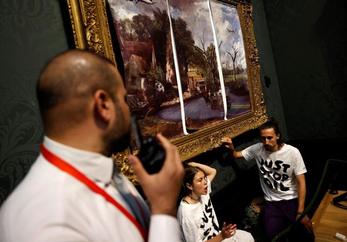 Climate protesters glue themselves to 200-year-old masterpiece