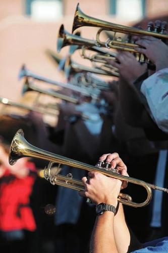 Dad-powered wheelchair aids teen in marching band  
