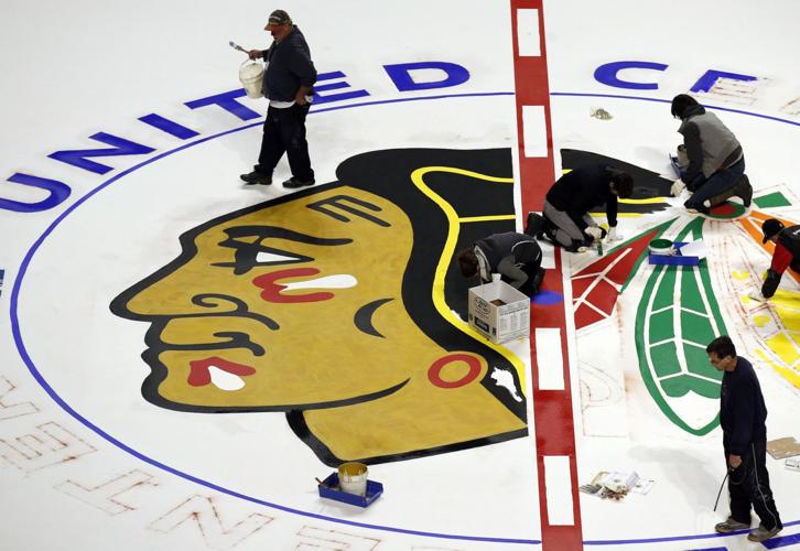 The annual and traditional painting of the Blackhawks logo on the United Center ice.